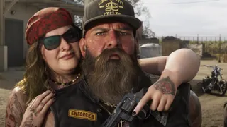 Ambrosia, official still: A couple in Ambrosia, one holding a handgun